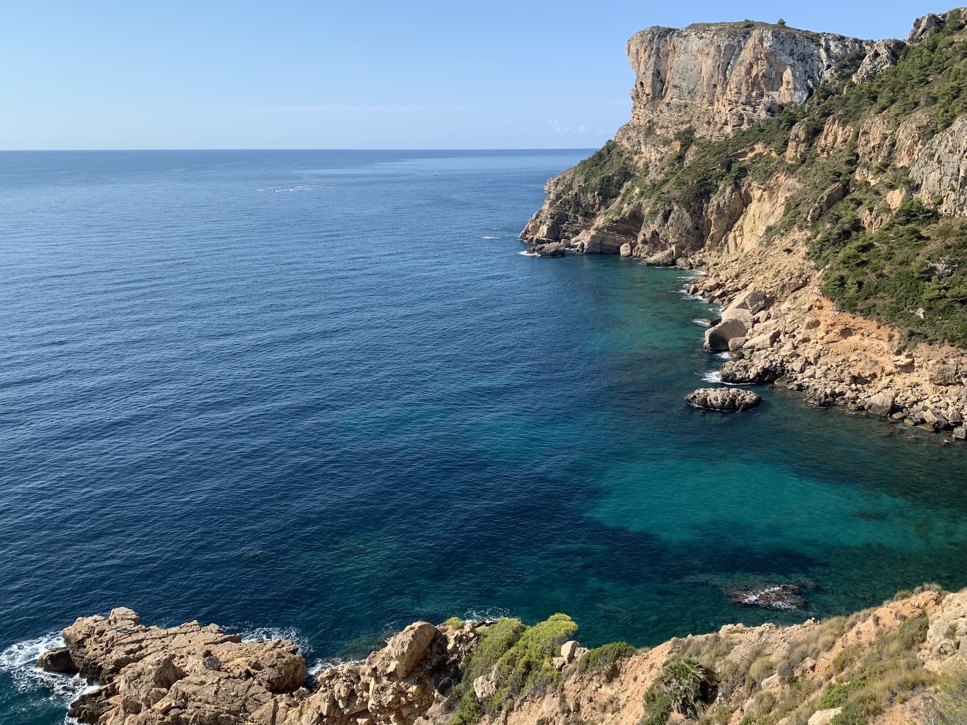 Water and high rocks during sunny day. Hiking in south of Spain.